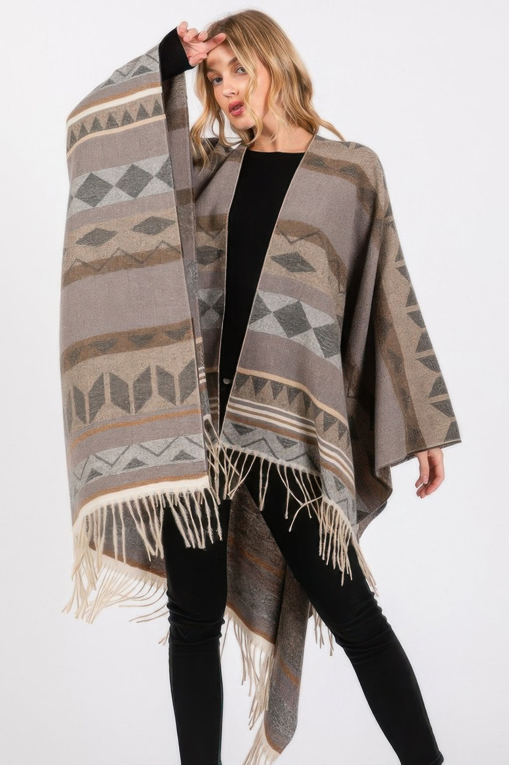 Aztec ruana in charcoal gray with diamond motifs and long cream fringe