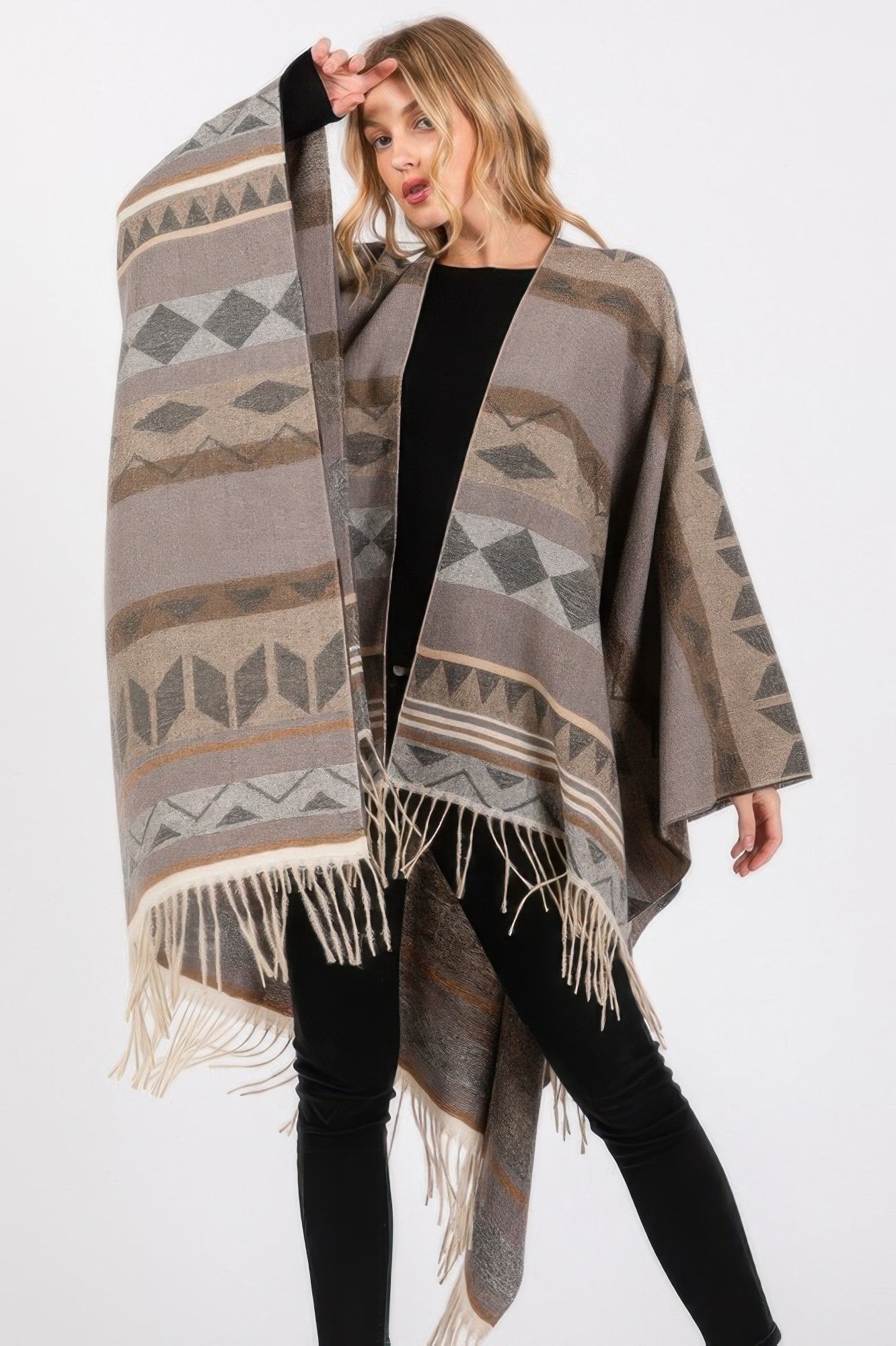 Aztec ruana in charcoal gray with diamond motifs and long cream fringe