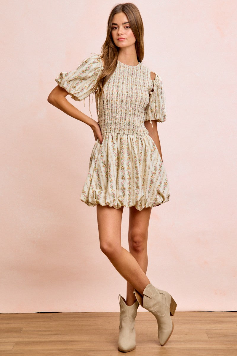 Ivory floral smocked mini dress with tie puff sleeves and gathered, flared skirt