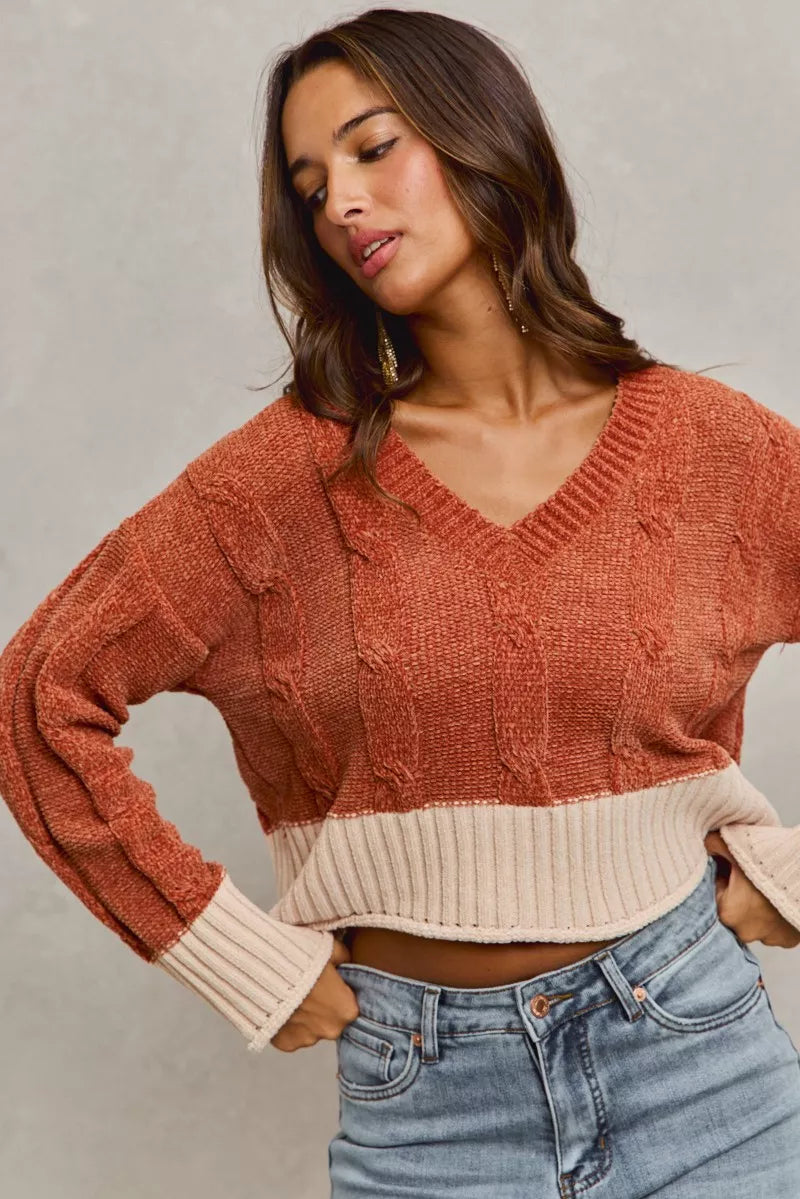 Rust chenille cable-knit cropped sweater with V-neck and contrast ribbed waist