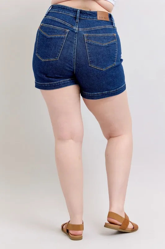 Dark blue denim shorts, back view with two pockets and belt loops