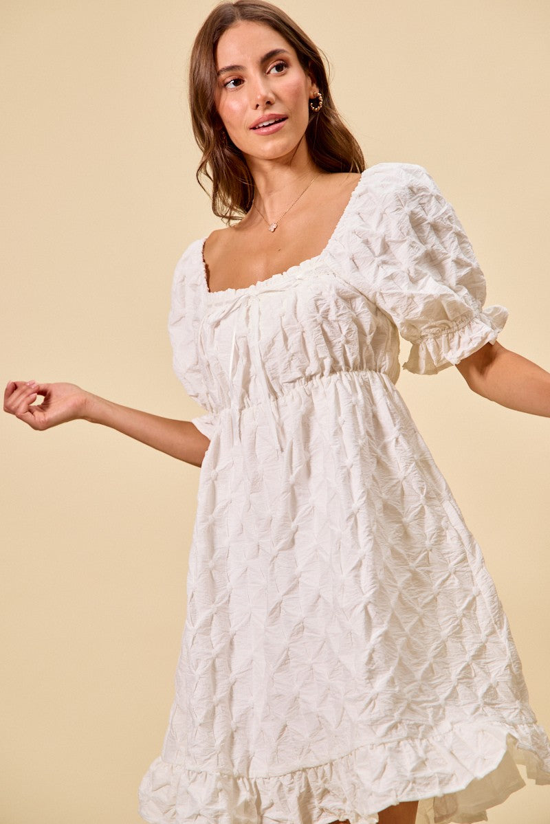 Off-white mini dress front view, square neckline, gathered bust and puff sleeves