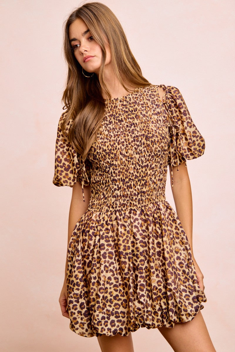 Leopard print puff-sleeve mini dress with gathered waist and tiered skirt