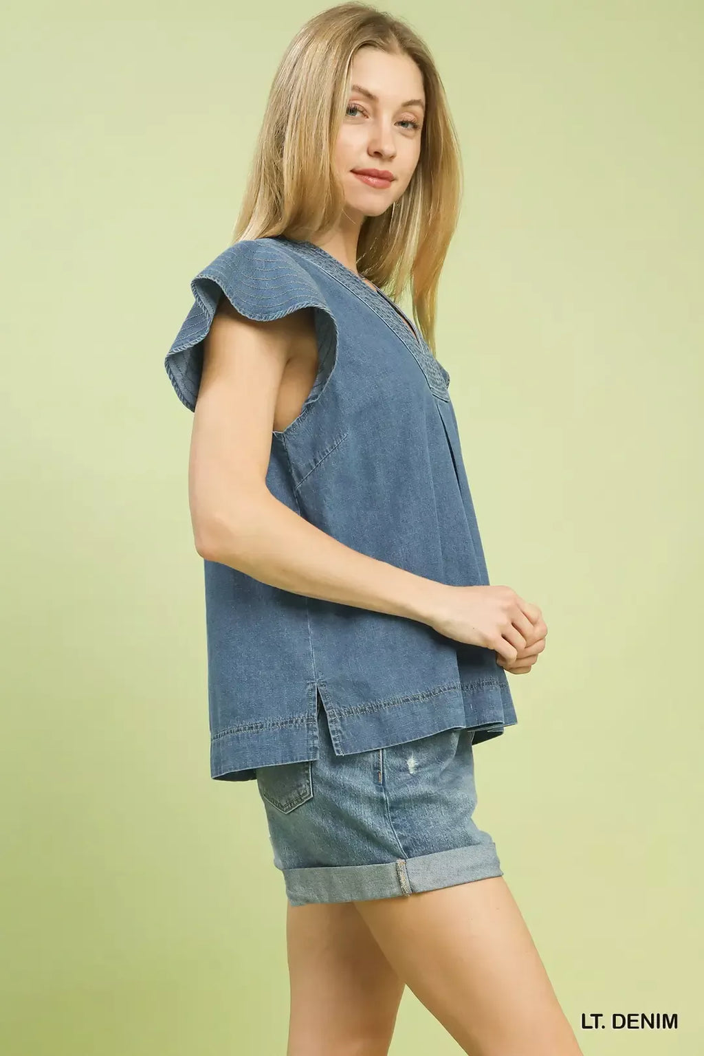 Light denim cap-sleeve top with V-neck and side split hem