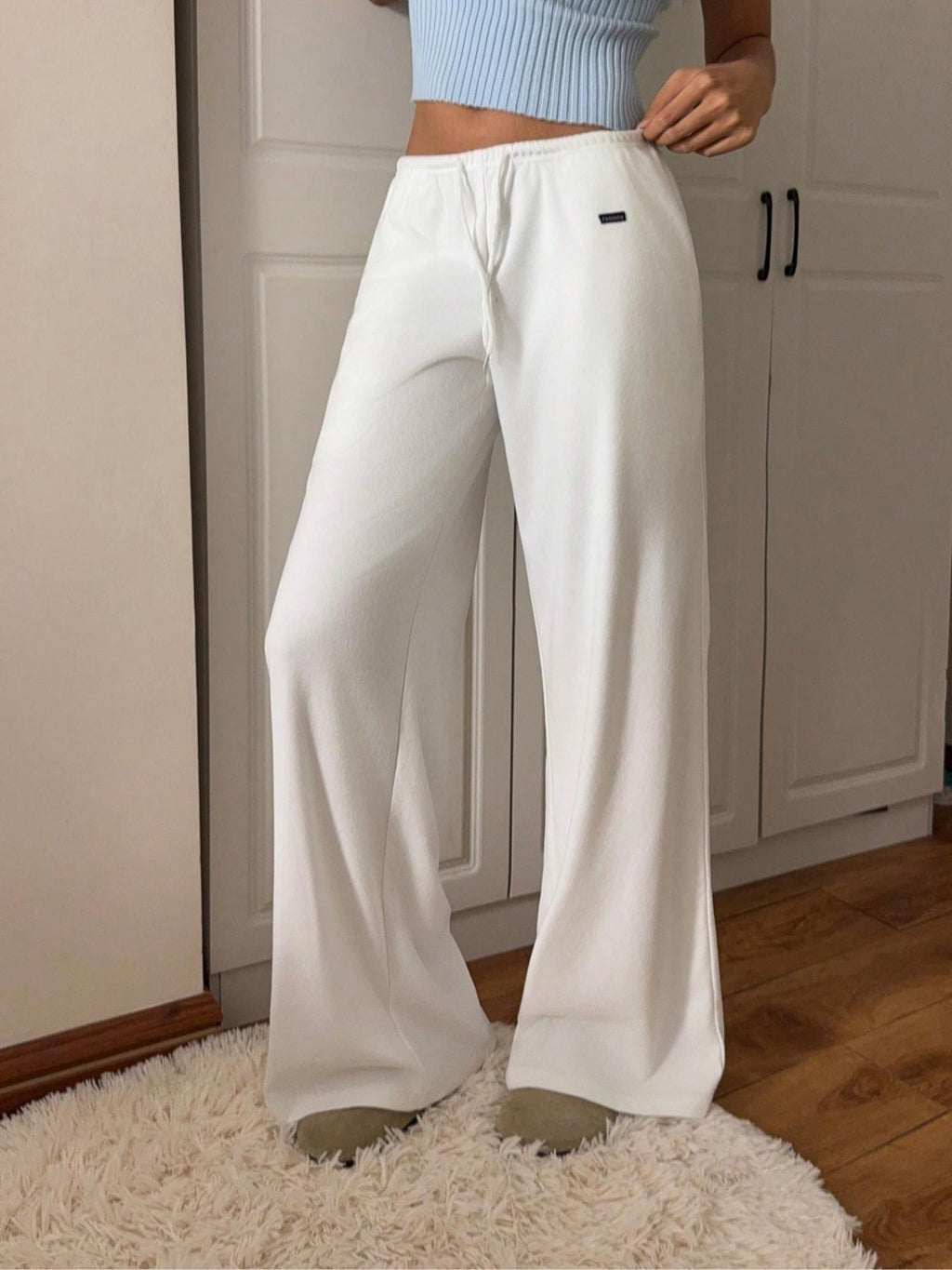 White relaxed fit drawstring pants, loose wide-leg silhouette