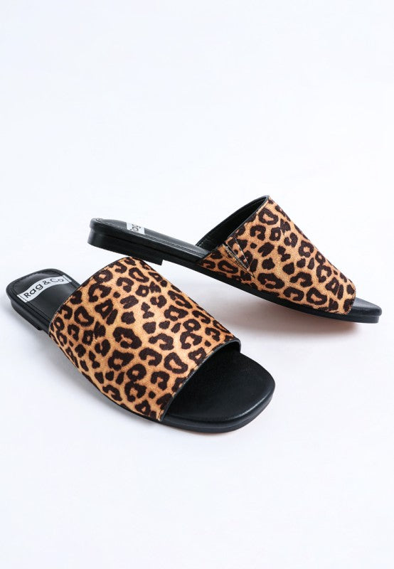 Leopard print slider flats with black sole and broad front strap