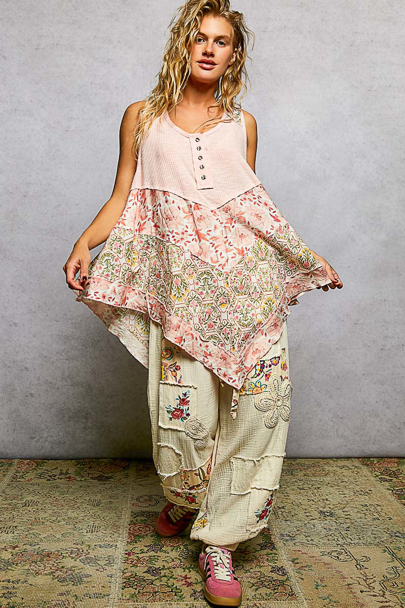 Blush pink ribbed tank with round neck, button front, and floral woven print patch