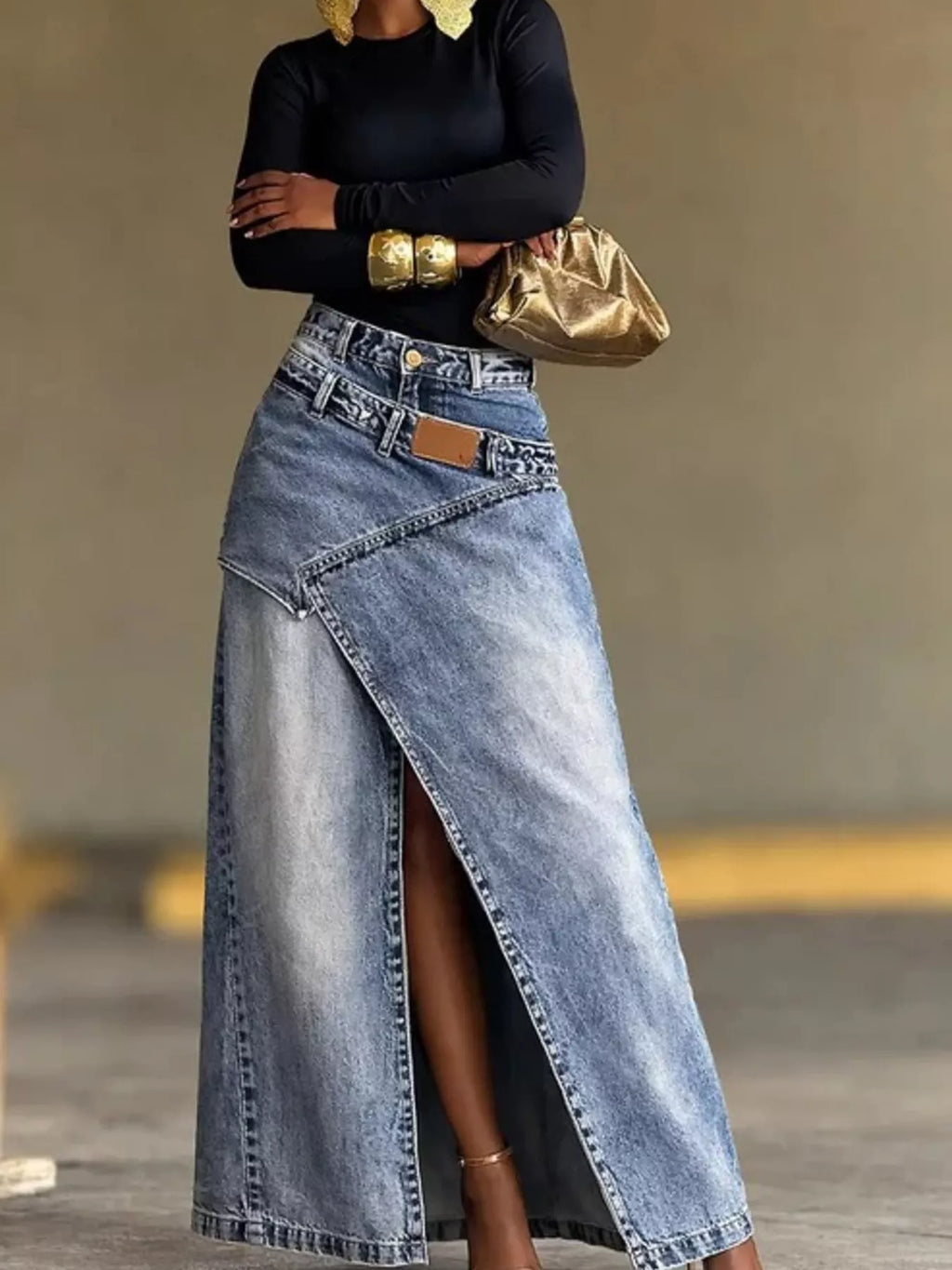 Blue high-waisted slit denim skirt with button fly, seamed front, and belt loops