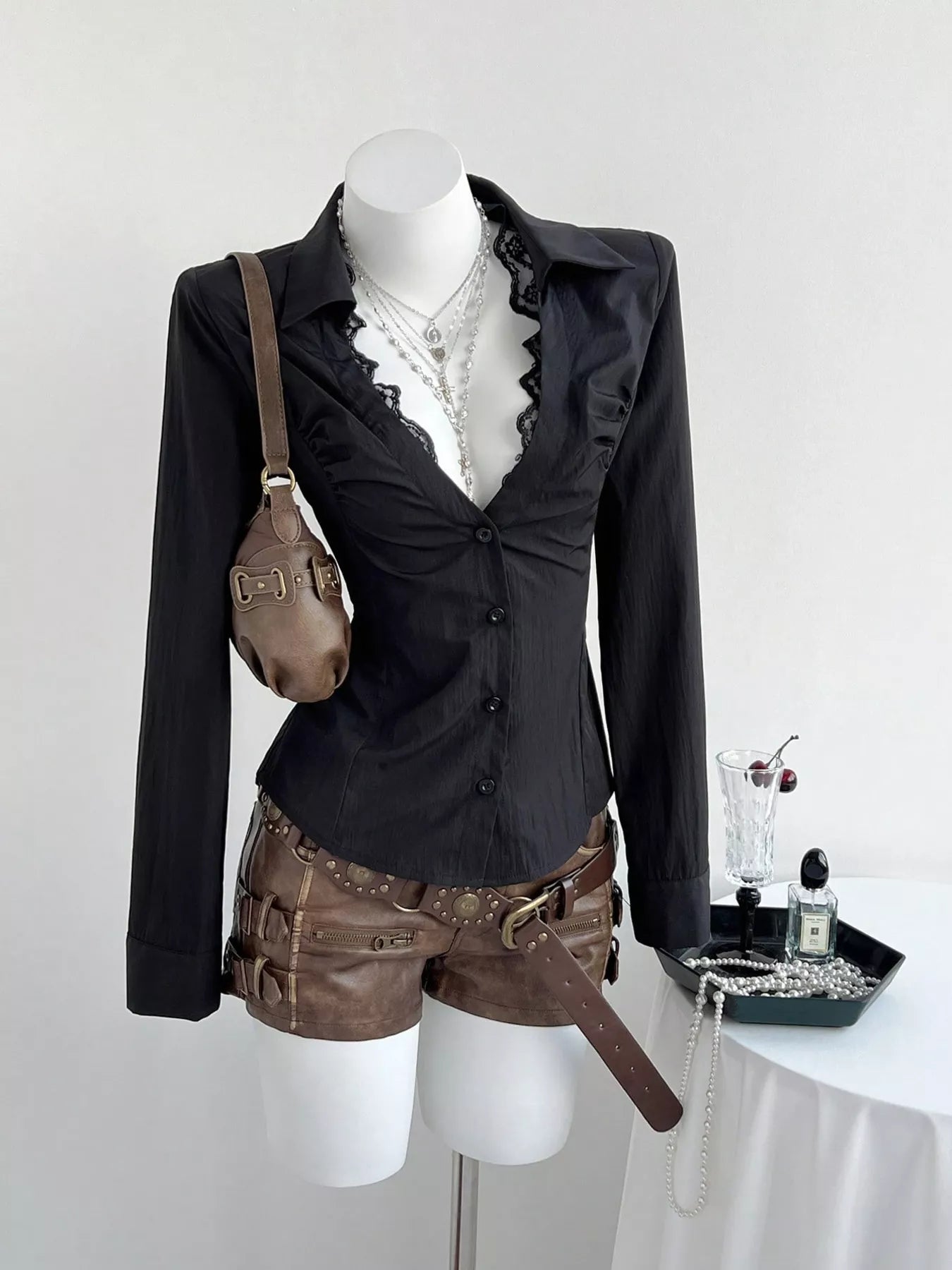 Black slim-fit shirt with lace-trim V-neck and button-front long sleeves