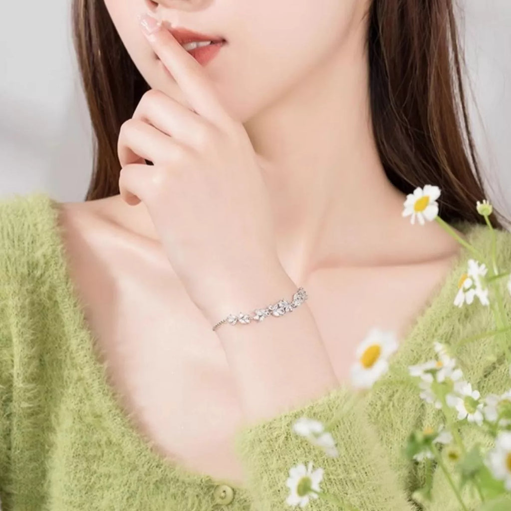 Wisteria zircon bracelet on wrist, linked marquise stone detail