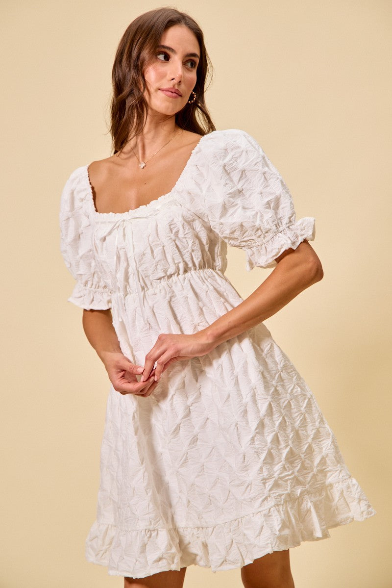 Off-white textured mini dress with ruched bust, gathered waist and puff sleeves