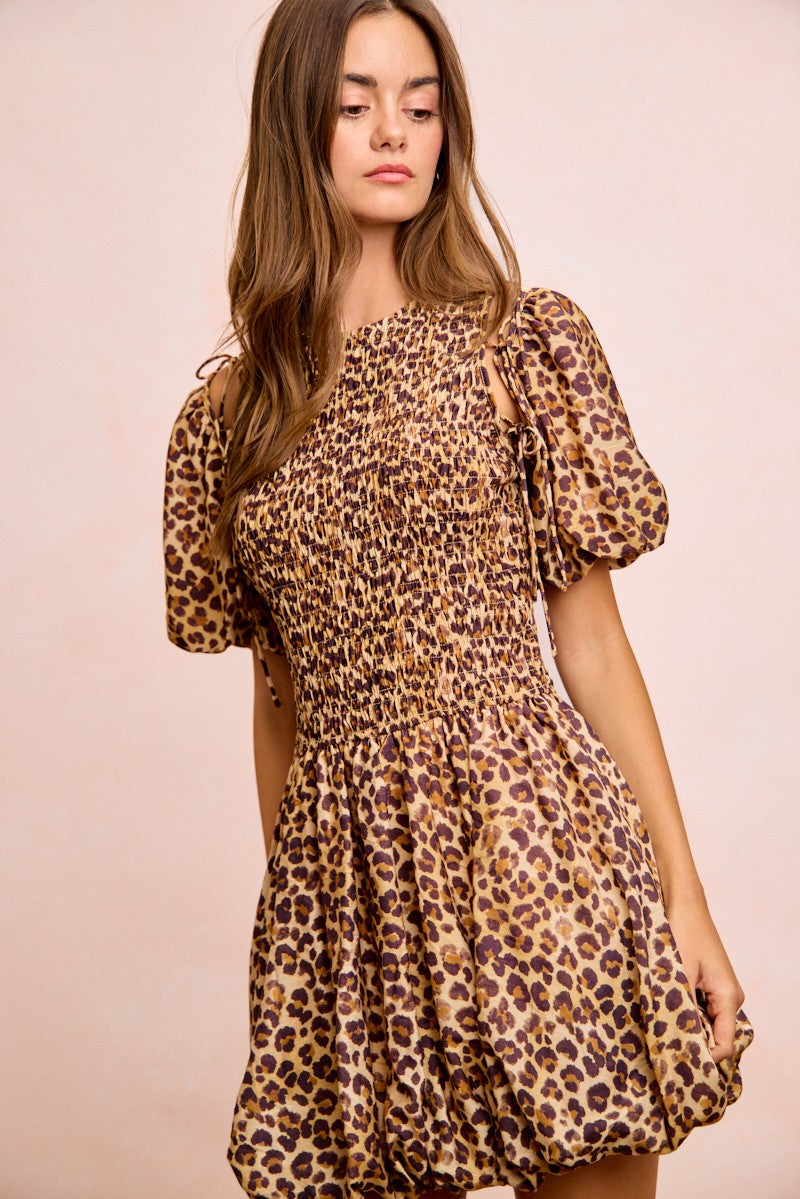 Leopard print dress with attached puff sleeves, ruched smocked bodice and tiered skirt