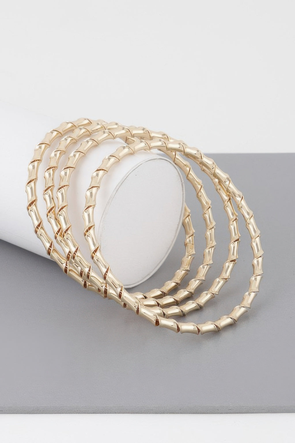 Gold bamboo twist bracelet, curved bangle with interlinked braided texture