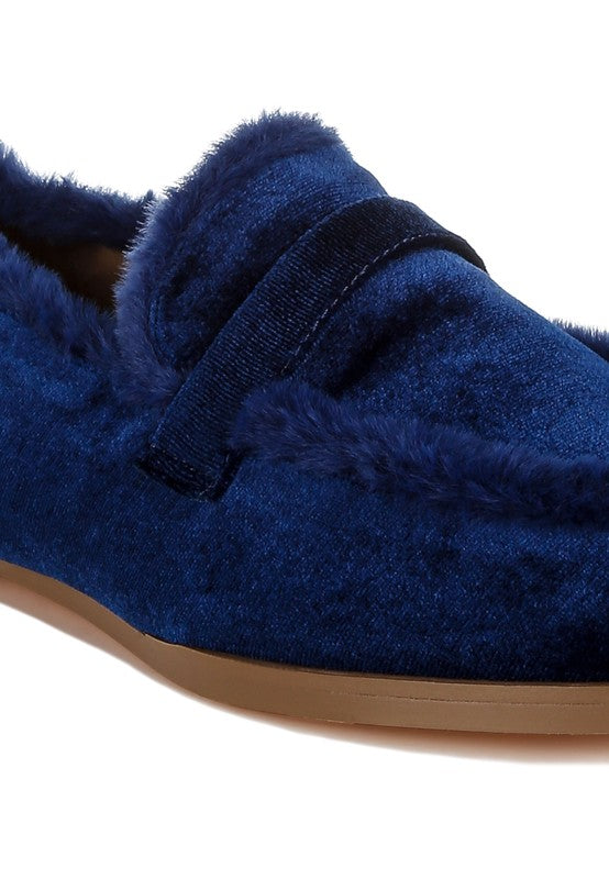 Blue velvet loafer, close-up of vamp strap and faux-fur edging