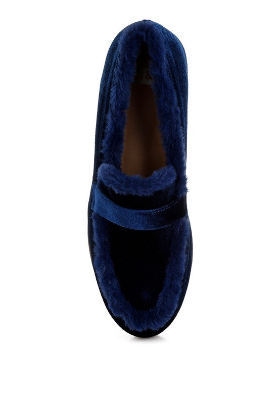 Blue velvet loafers, top view showing cutout opening and faux-fur trim