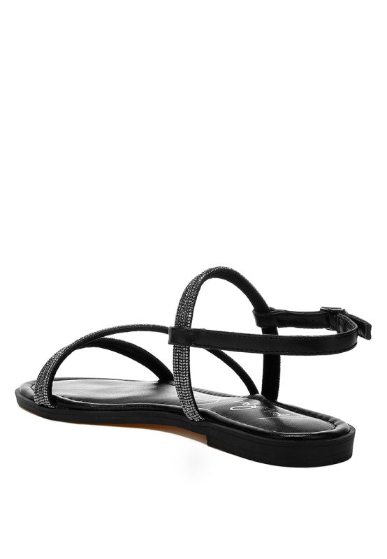 Sandalias negras planas con doble tira, tobillo ajustable y brillo tipo pedrería