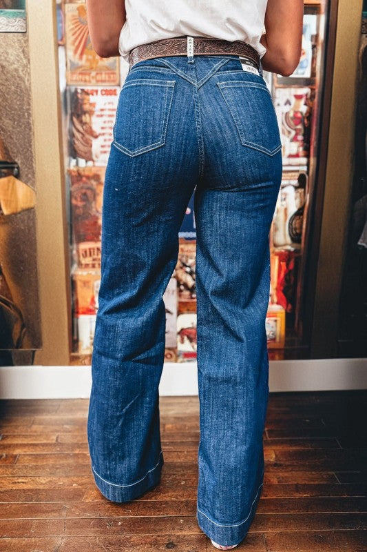 Loose cuffed jeans in Sail Blue, rear view with back pockets and denim wash