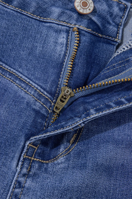 Beau Blue jeans close-up: gold zipper and stitched denim seam