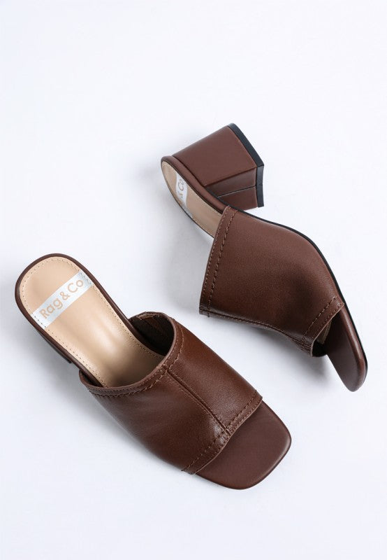Brown leather slip-on heels with open toe and squared heel detail