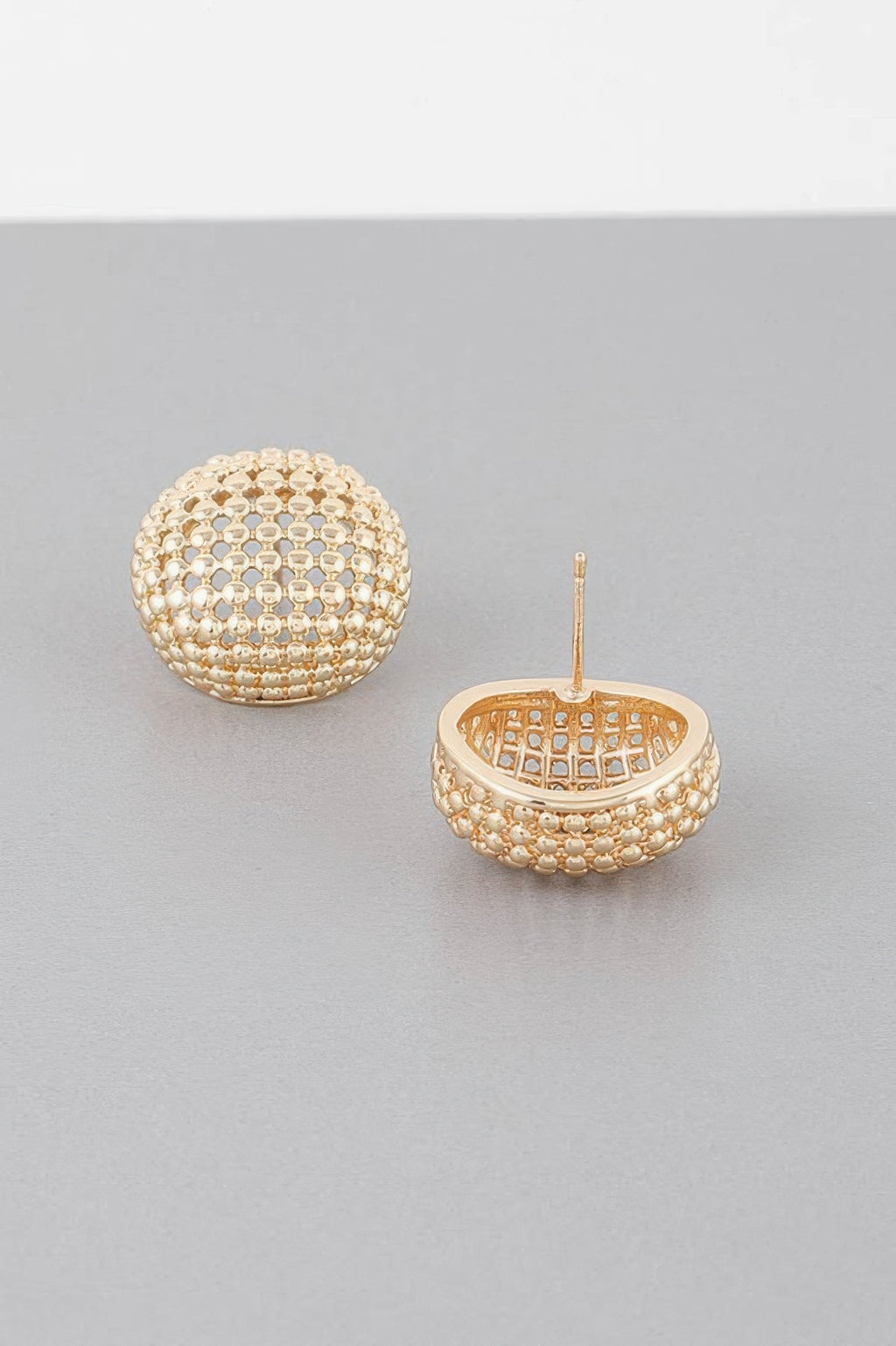 Gold tone beaded dome stud earrings, back view shows round setting and post