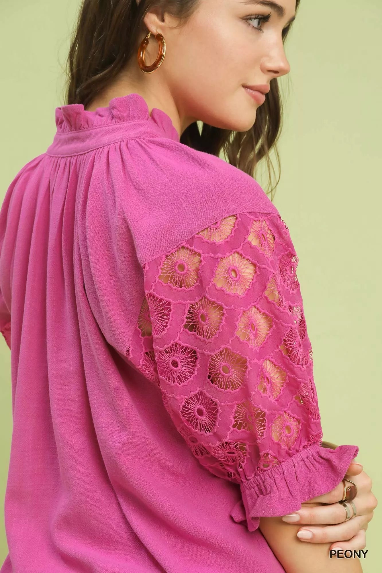 Close-up: PEONY pink blouse with ruffled yoke and lace puff sleeve cuff