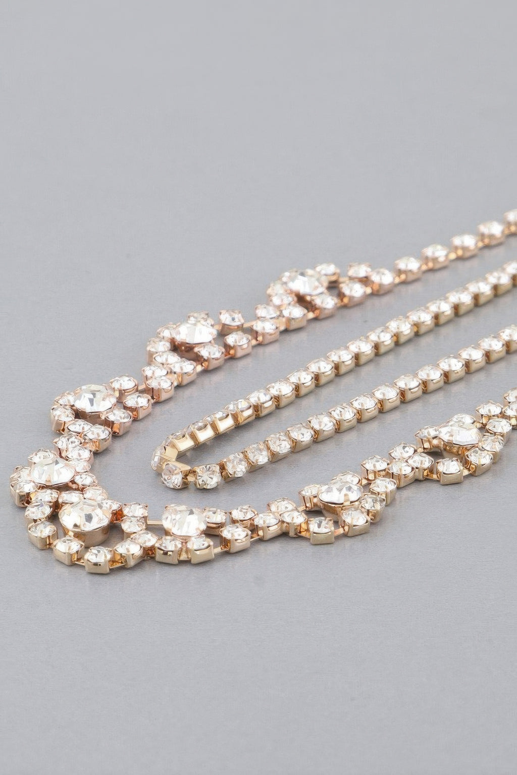 Gold rhinestone drop necklace with oval links and small chain fringe
