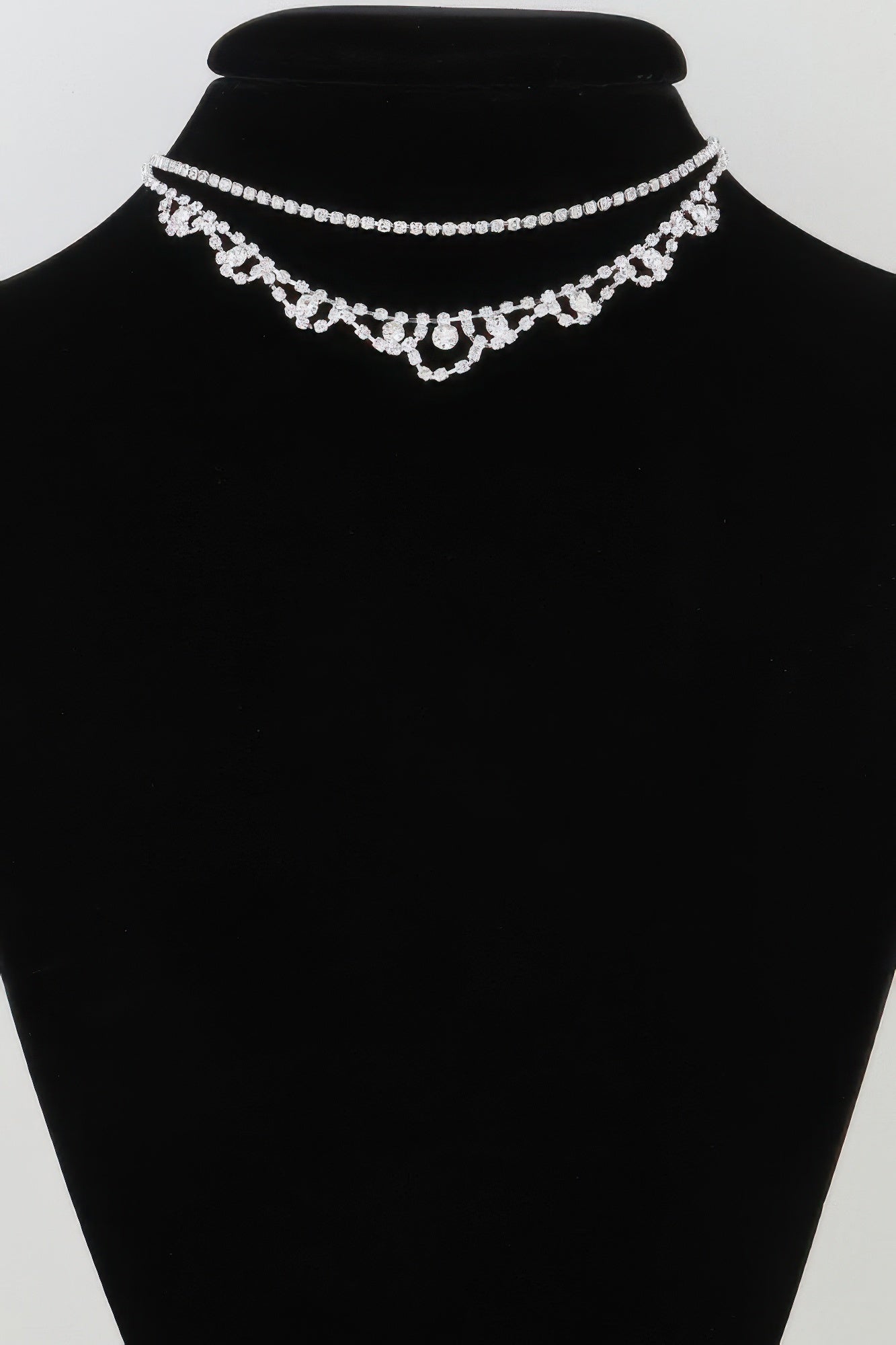 Silver rhinestone choker and drop pendant necklace on bust