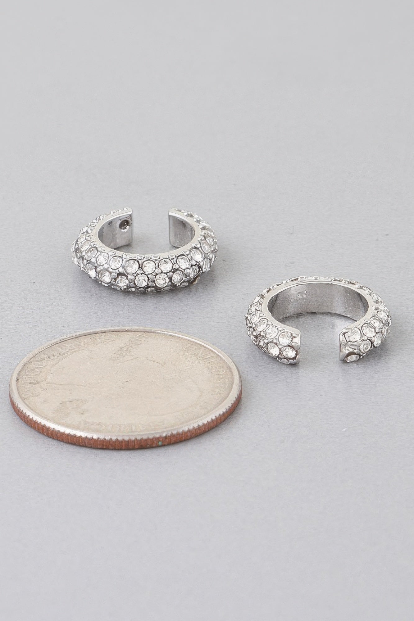 Silver-tone ear cuff with clear crystal stones, open semi-cuff design