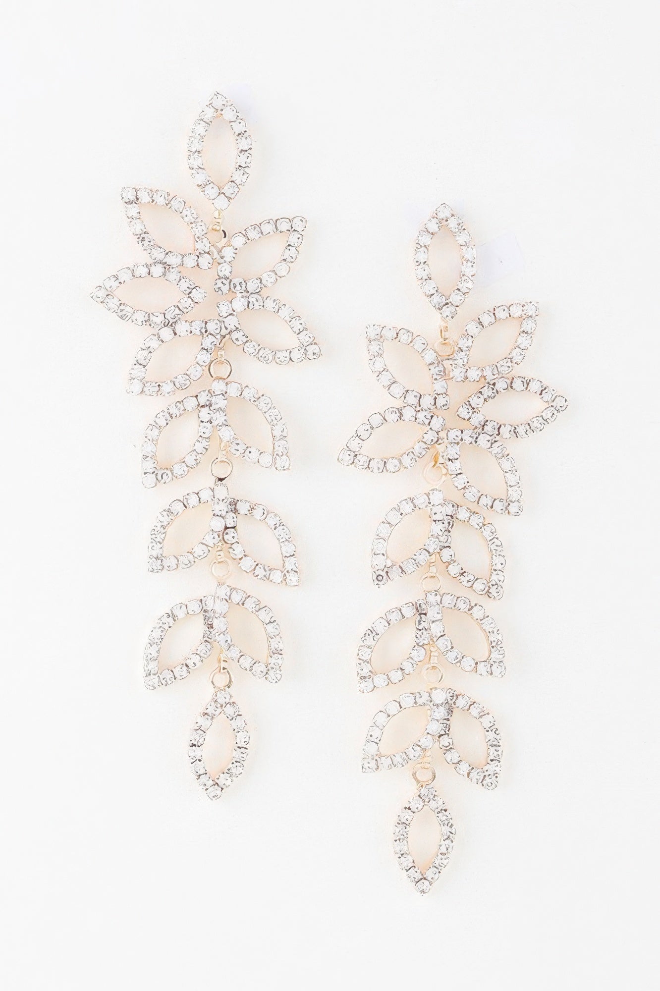 Bejeweled flower petal drop earrings with leaf-and-petal shapes and clear stones