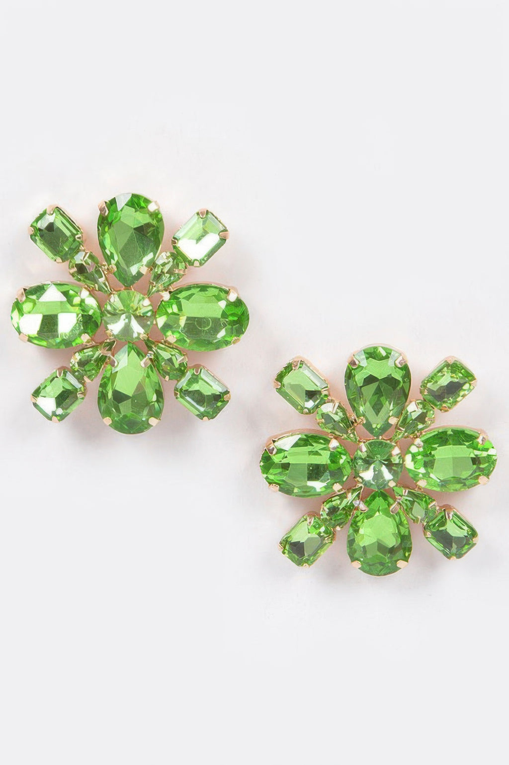 Green crystal flower stud earrings with gold-tone prong settings and faceted stones