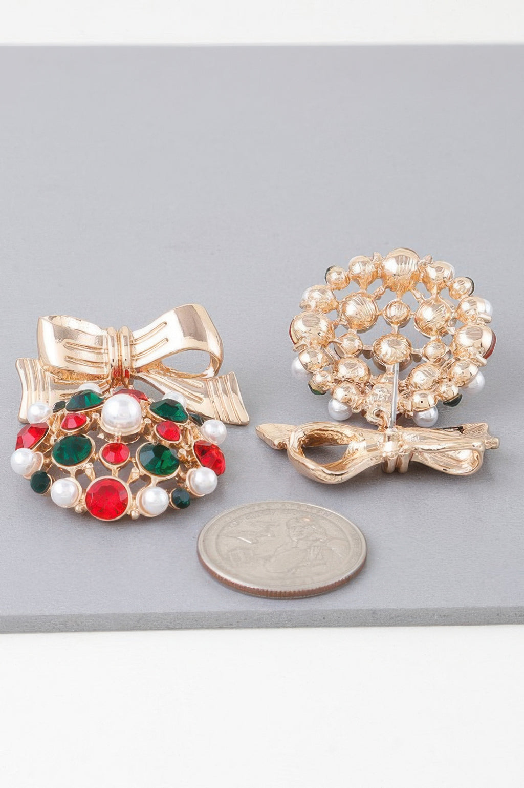 Gold ribbon bow bejeweled earrings with red, green stones and white pearls