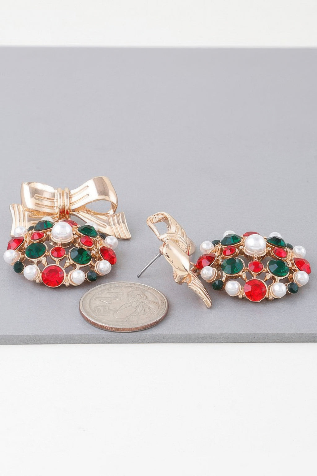 Gold multicolor ribbon ornament earrings: bow tops with red, green stones, white pearls