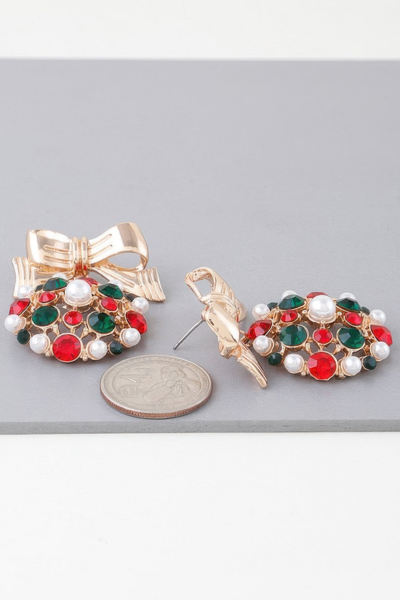 Gold multicolor ribbon ornament earrings: bow tops with red, green stones, white pearls
