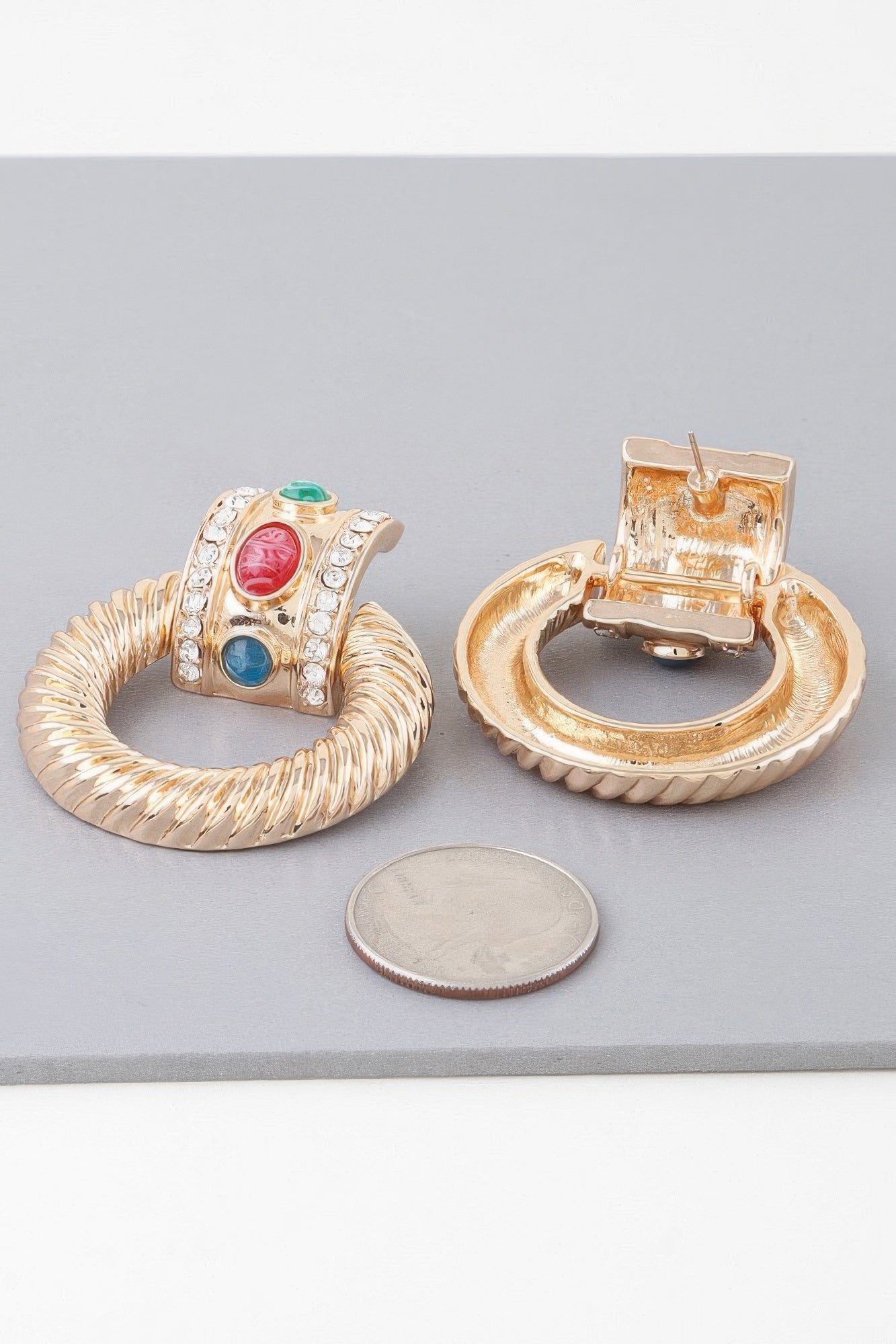 Gold multicolor twisted hoop drop earrings showing back and front with red, green & blue gems