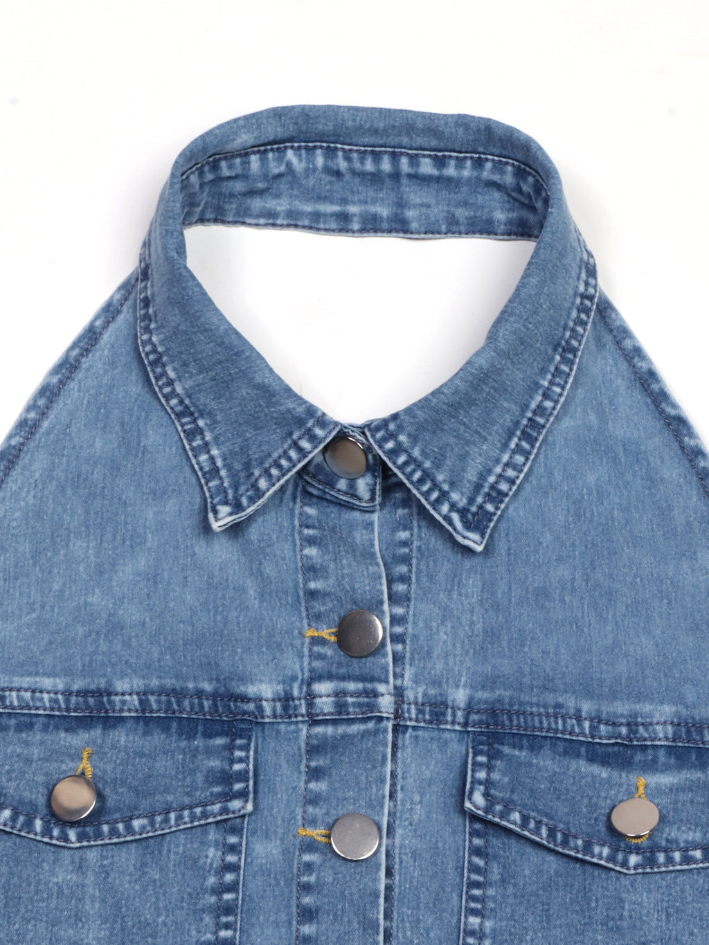 Close-up of halter neckline and front buttons on light blue denim dress