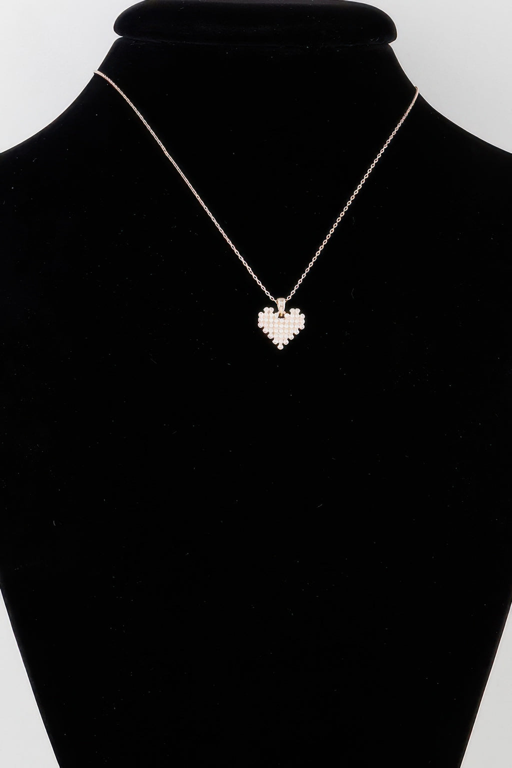Gold-tone pearl block heart necklace with small heart pendant on chain