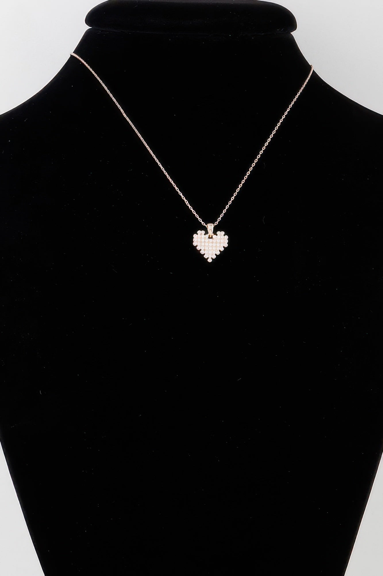 Gold-tone pearl block heart necklace with small heart pendant on chain