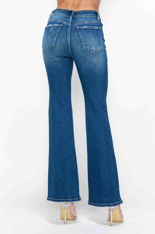 Medium blue high-rise bootcut jeans with back pockets and faded denim wash