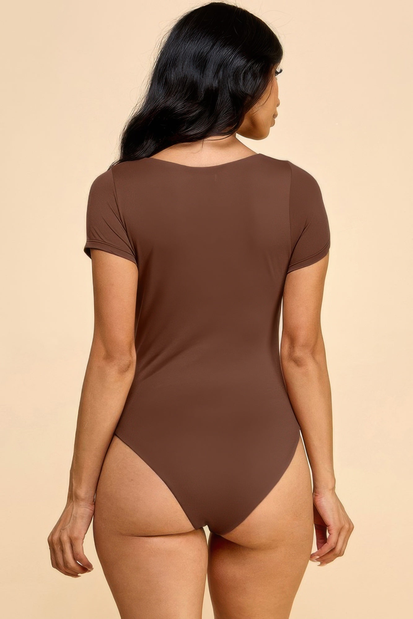 Back view: brown short-sleeve scoop neck double-layer bodysuit, fitted thong