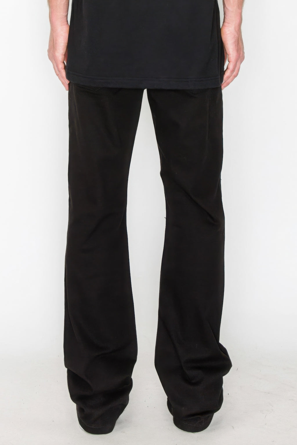 Bootcut jeans in black, back view with subtle distressed repair details