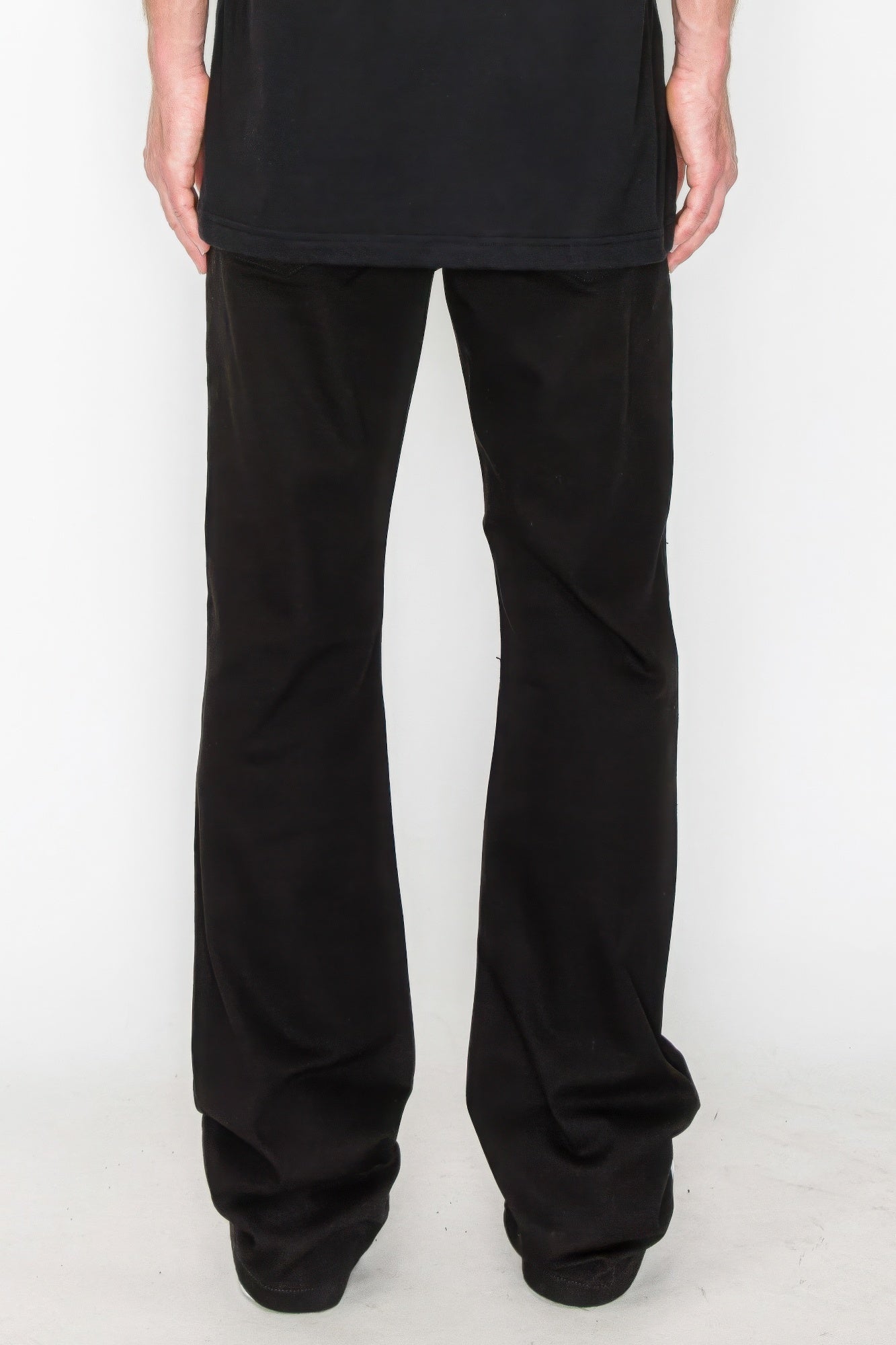 Bootcut jeans in black, back view with subtle distressed repair details