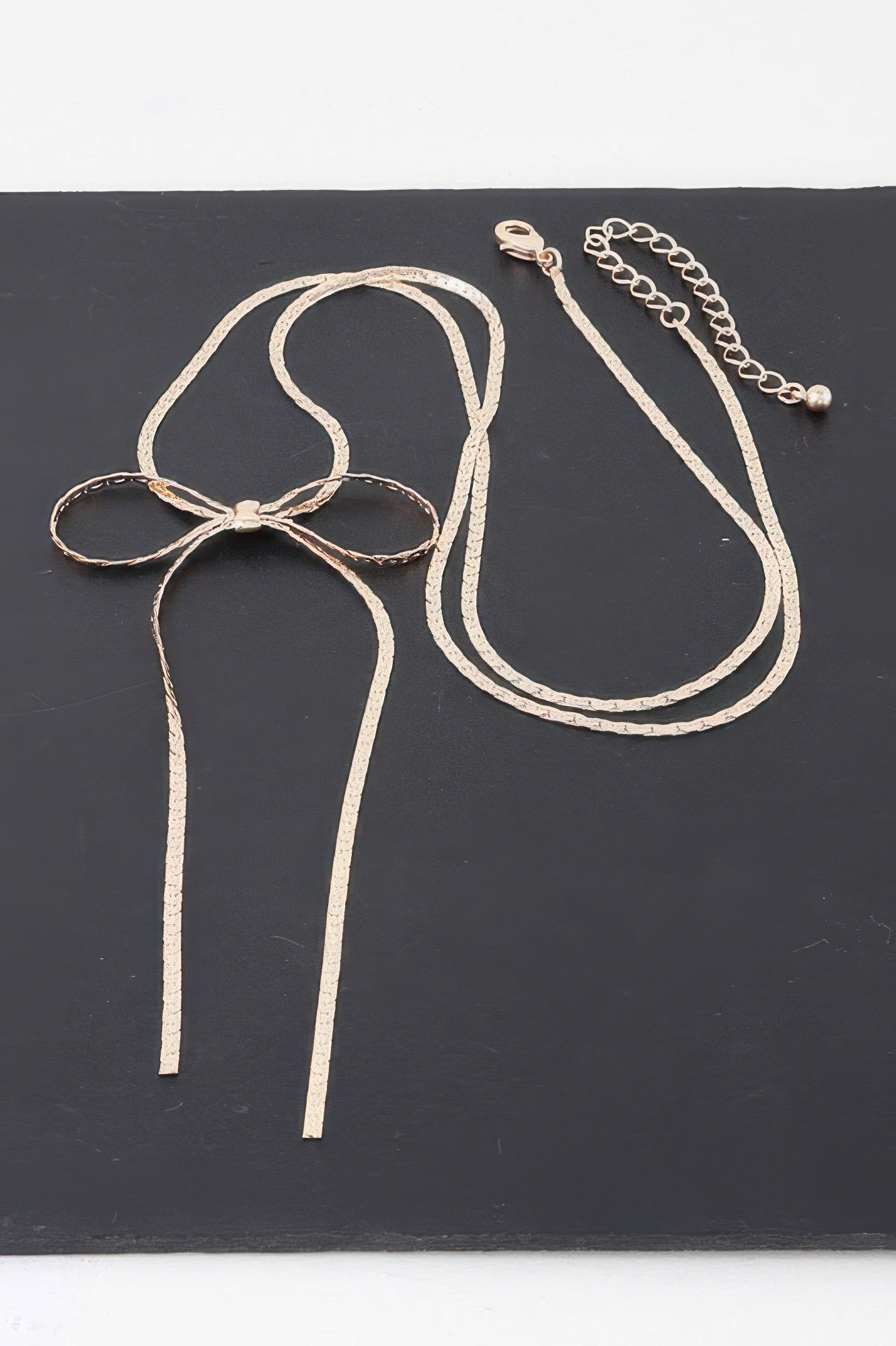 Bow necklace bow pendant with long chain tassels and clasp, gold-tone