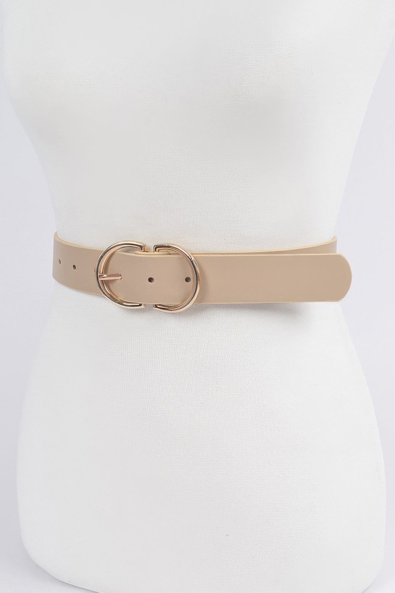 Nude belt close-up: round double buckle with keeper and perforated strap