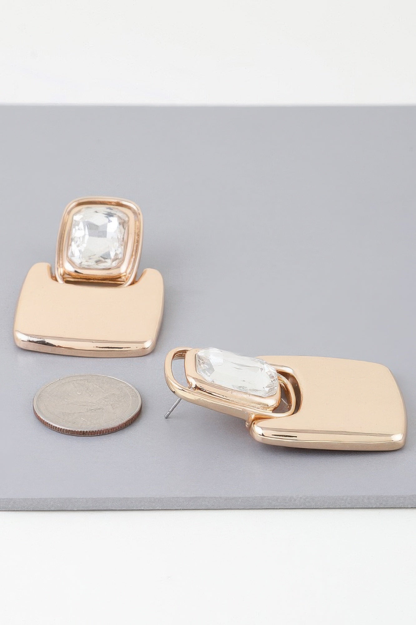 Bright cubic jewel drop earrings, gold with clear square stones