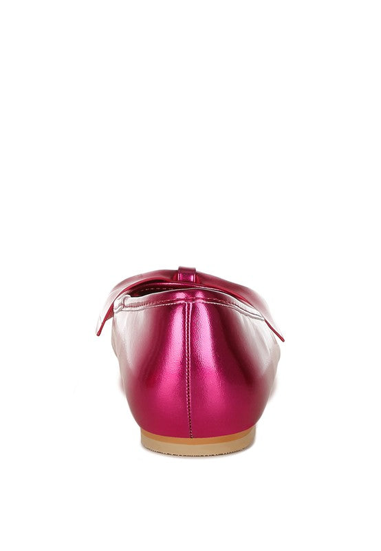 Fuchsia metallic pleather ballerinas from back, bow centered