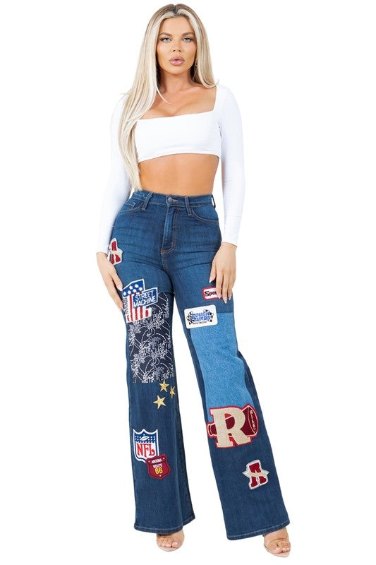 Dark wash Brooklyn varsity jeans with stitched patches on front legs, wide-leg fit