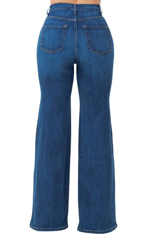 Dark wash denim jeans back view with two rear pockets and waistband button/zip