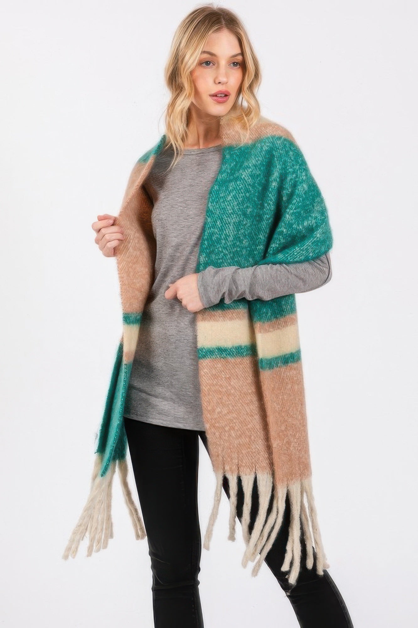 Brushed scarf with teal and tan stripes and creamy fringe, draped over shoulder