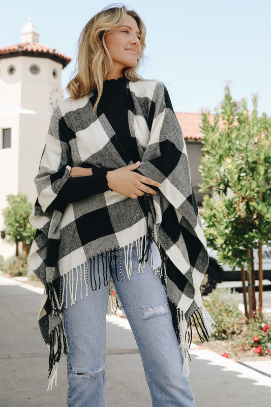 Gray-black-white buffalo check poncho with long tassels and loose drape