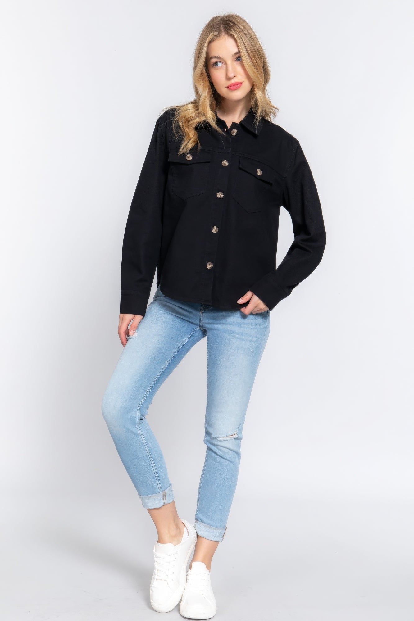 Black denim shacket with button closure and two chest flap pockets